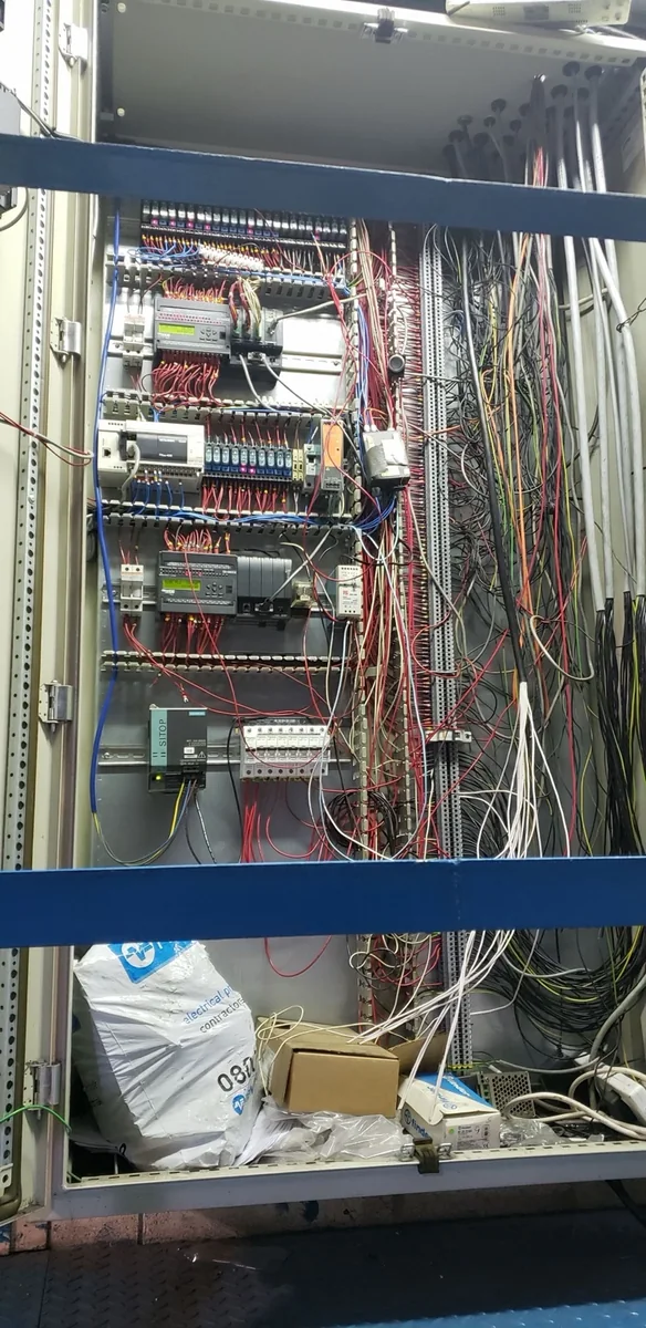 Legacy industrial controls panel before modernization